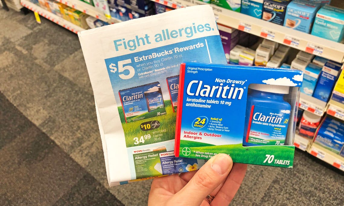 A pack of Claritin allergy medicine next to Advertisement for $5 extrabucks rewards.