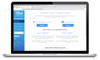 laptop showing a screenshot comparing the disney visa and premier credit cards