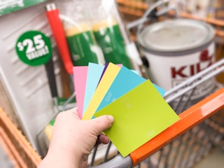 someone holding paint samples