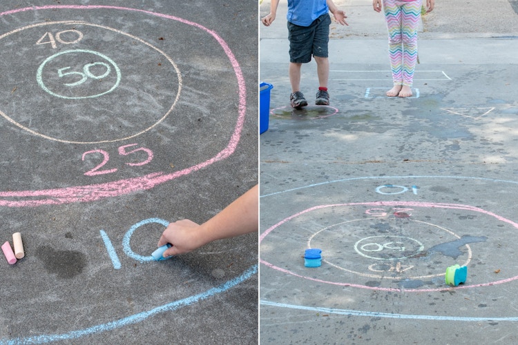 A person's hand drawing the number 10 on a target of chalk, and two children throwing sponges into the chalk target.
