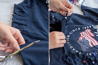 A person's hands using scissors to cut lines along the sleeve of an Old Navy Fourth of July t-shirt and putting beads on the loose strips.