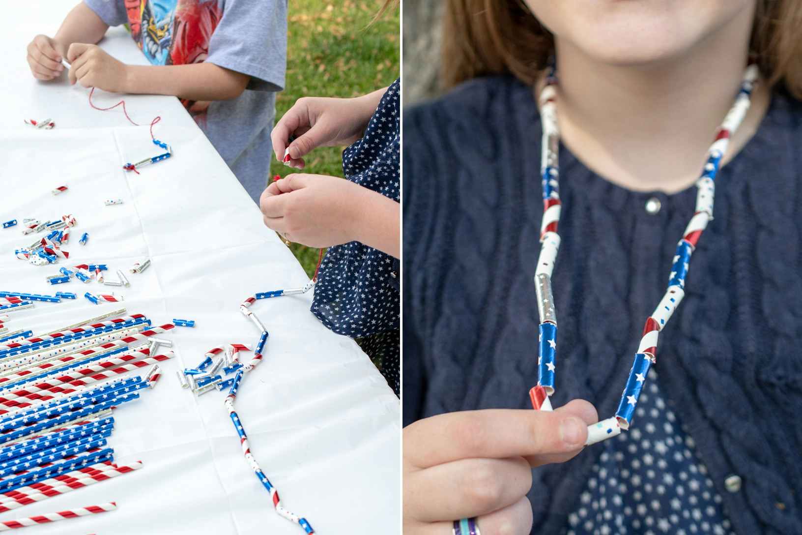 Two kids sitting at a table outside and making DIY necklaces using cut-up, red, white, and blue patterned paper straws and string.