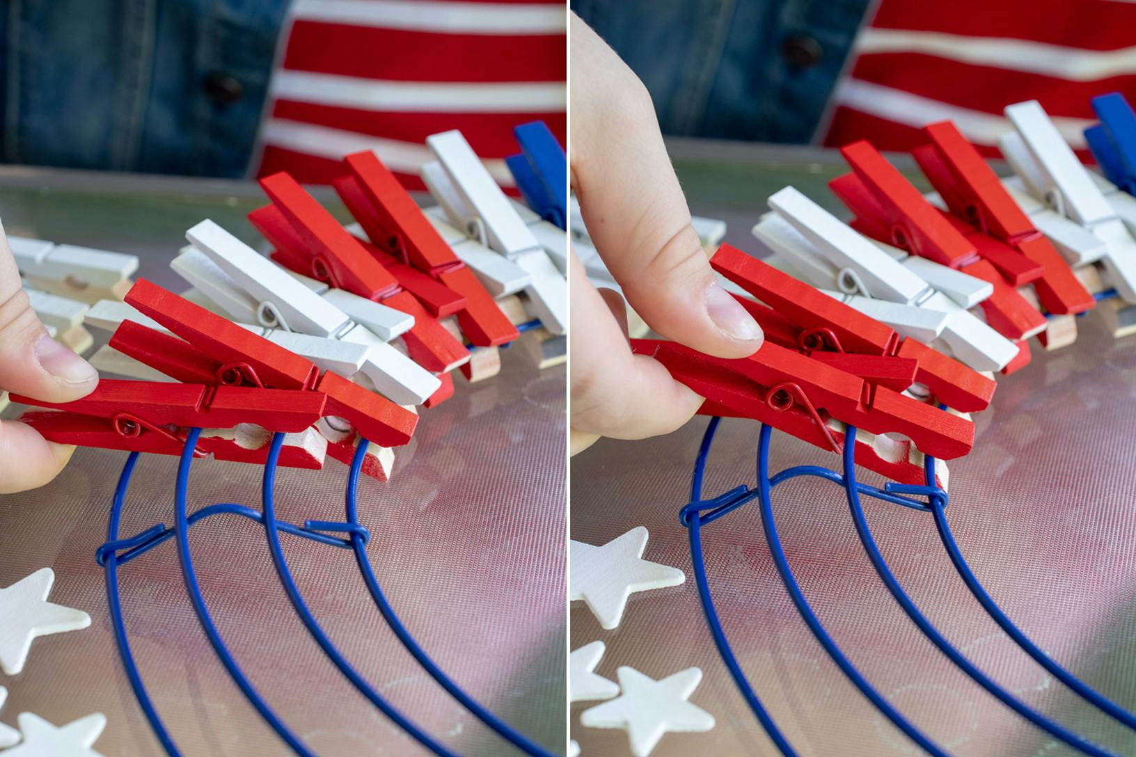 A person clipping the painted clothespins to a wreath frame in a red, white, and blue pattern.