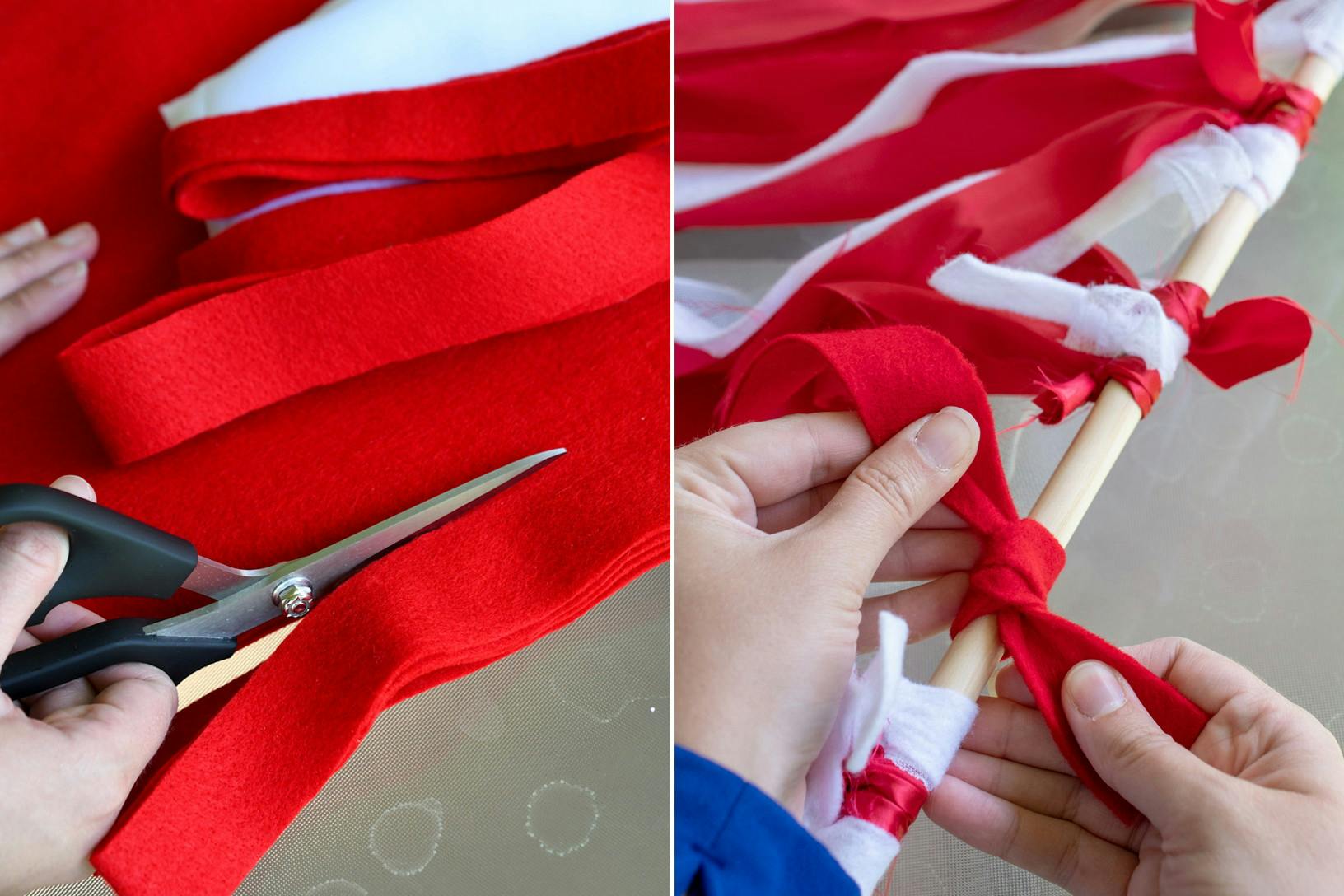 A person cutting strips of red and white felt and tying them to a wooden dowel.