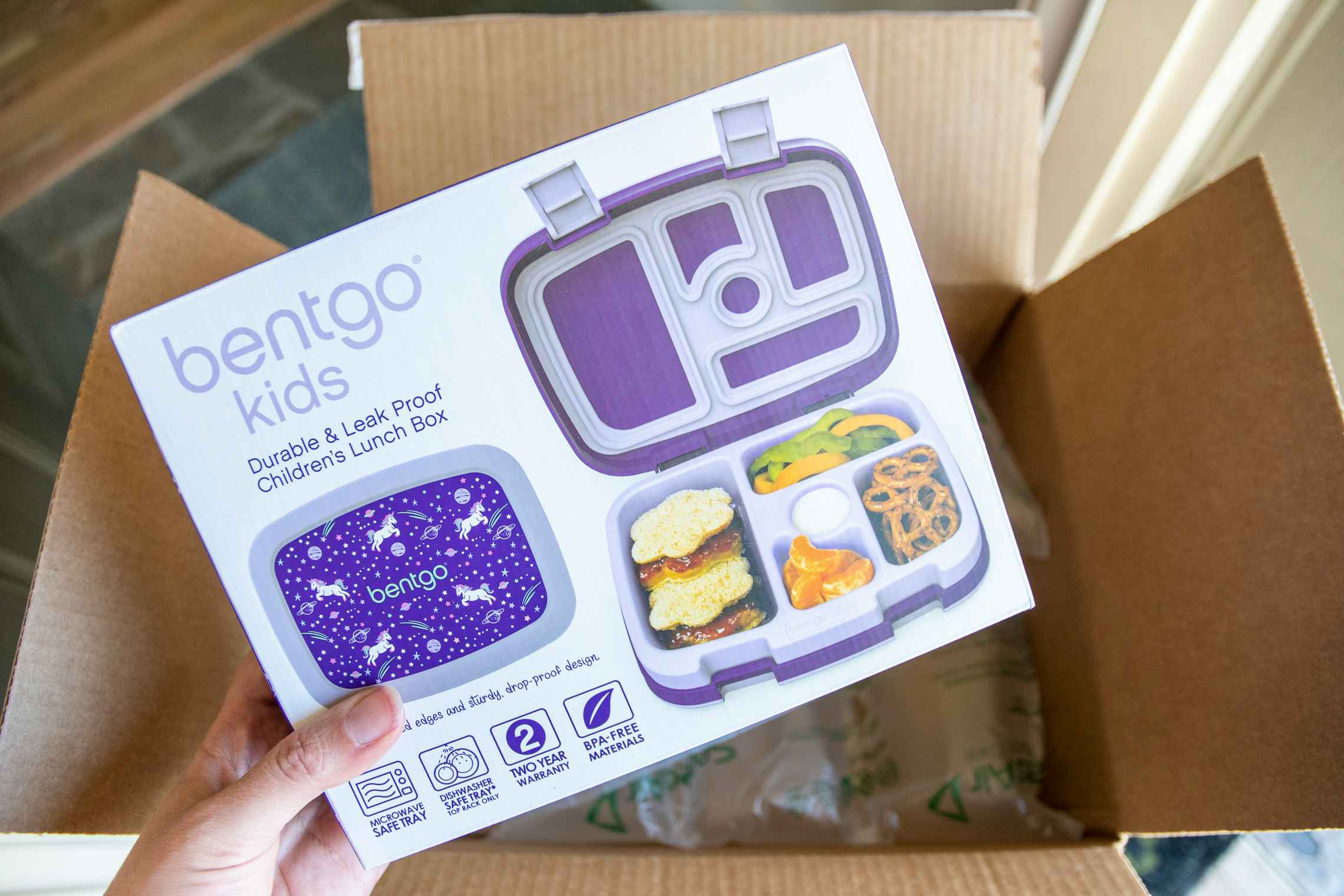 Bentgo kids lunch box being pulled from an amazon box