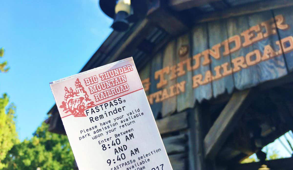 A fastpass reminder ticket for Big Thunder Mountain Railroad in front of the ride's entrance at Disneyland.