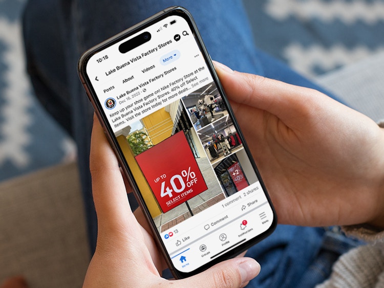 Someone looking at a Facebook post from a local outlet mall advertising their Nike Factory Outlet sale