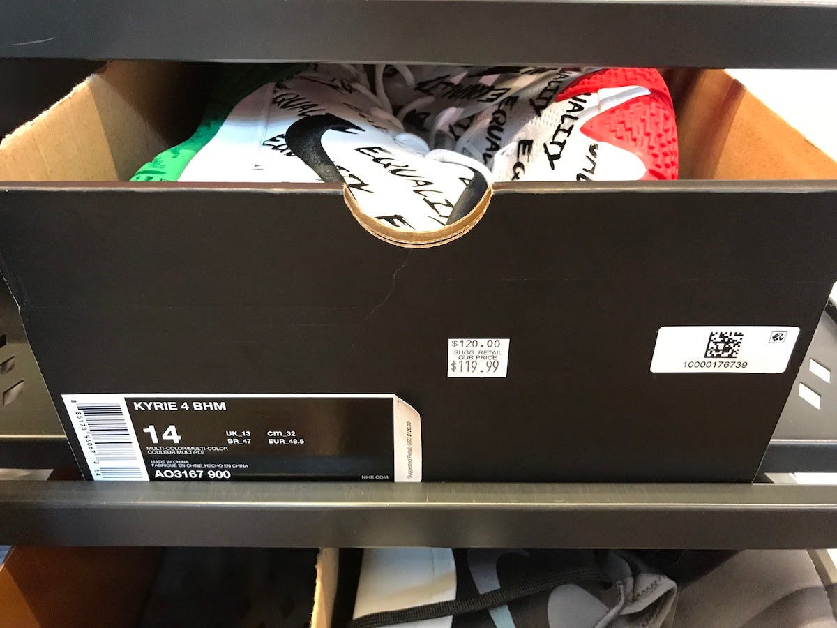 A box of Nike shoes on the "Hash Wall" with a sticker marking them down from $120.00 to $119.99