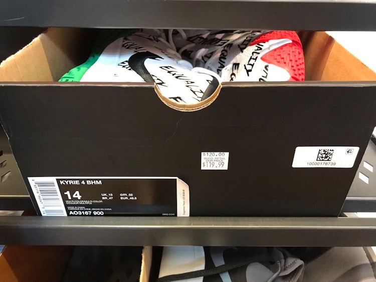A box of Nike shoes on the "Hash Wall" with a sticker marking them down from $120.00 to $119.99
