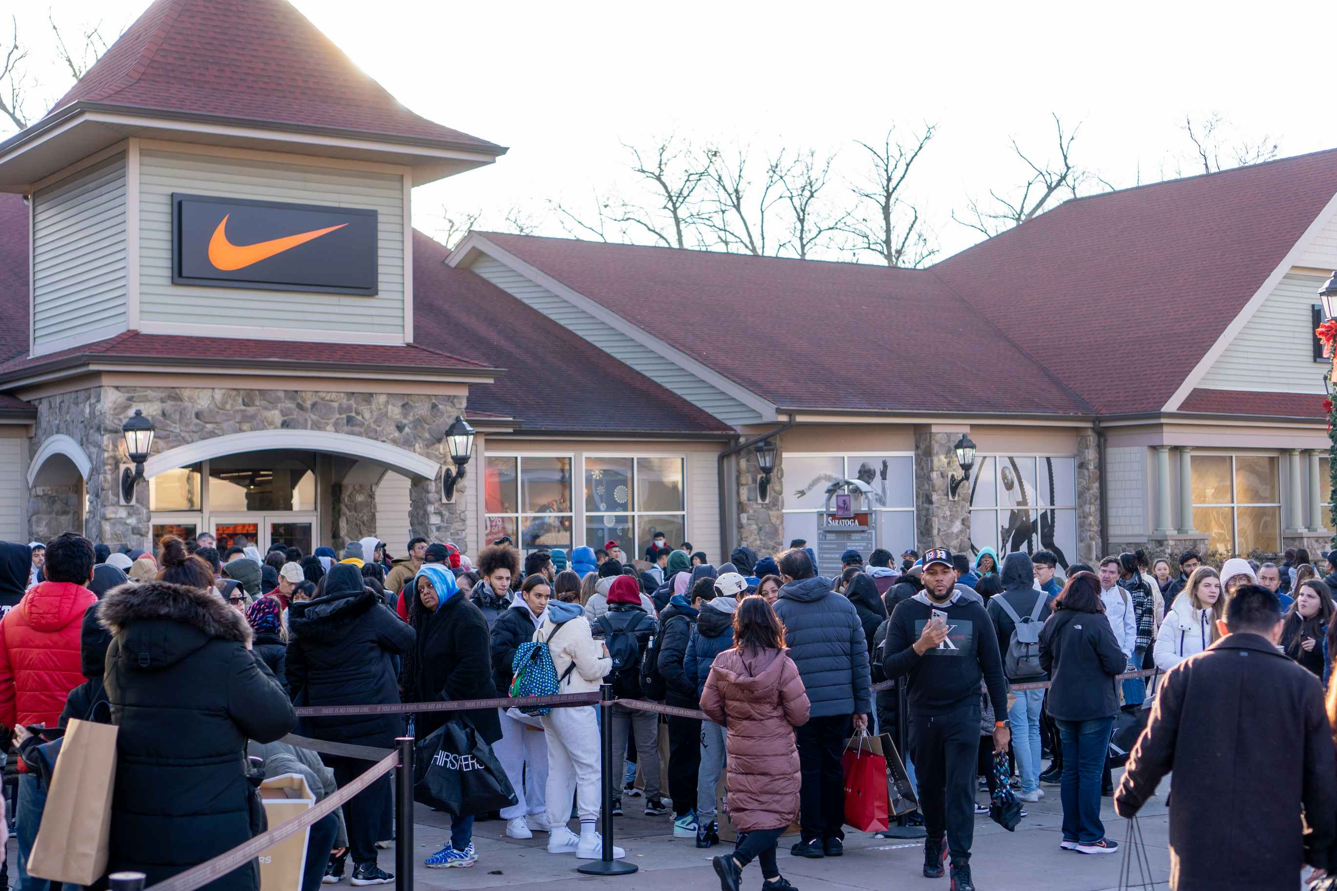 People standing in like to shop Nike on Black Friday