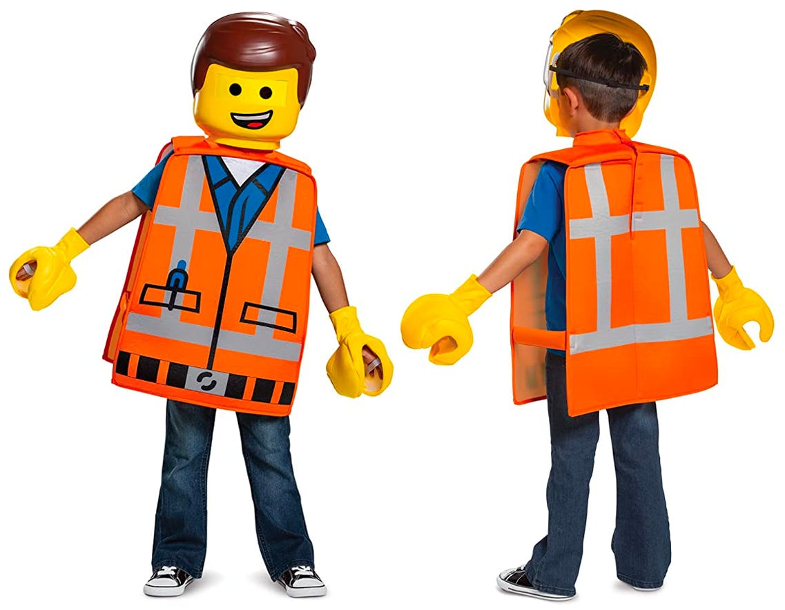 A boy dressed as Emmet Brickowski from the LEGO movie on a white background