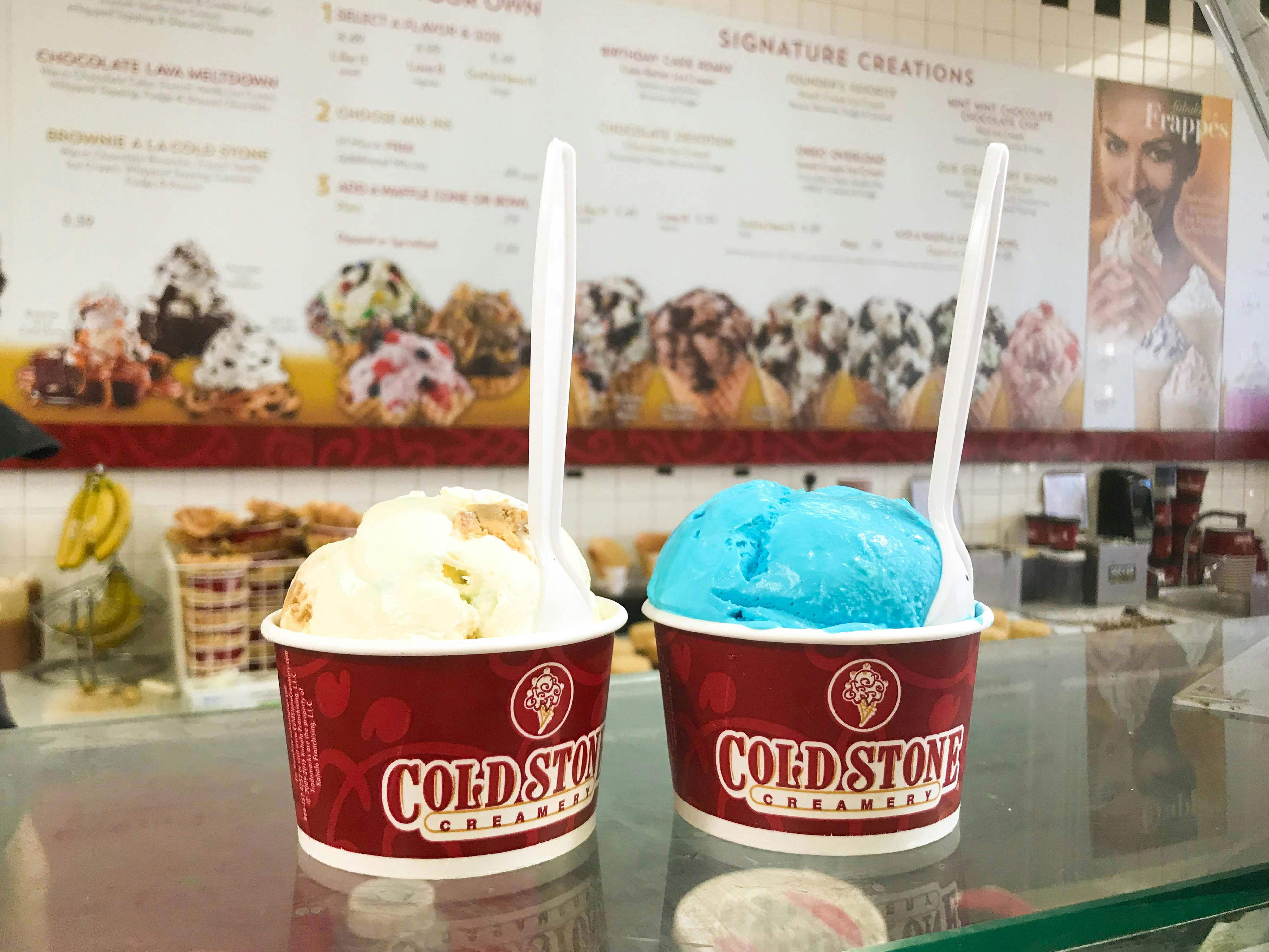 Two cups of small ice cream at Cold Stone Creamery on the counter.