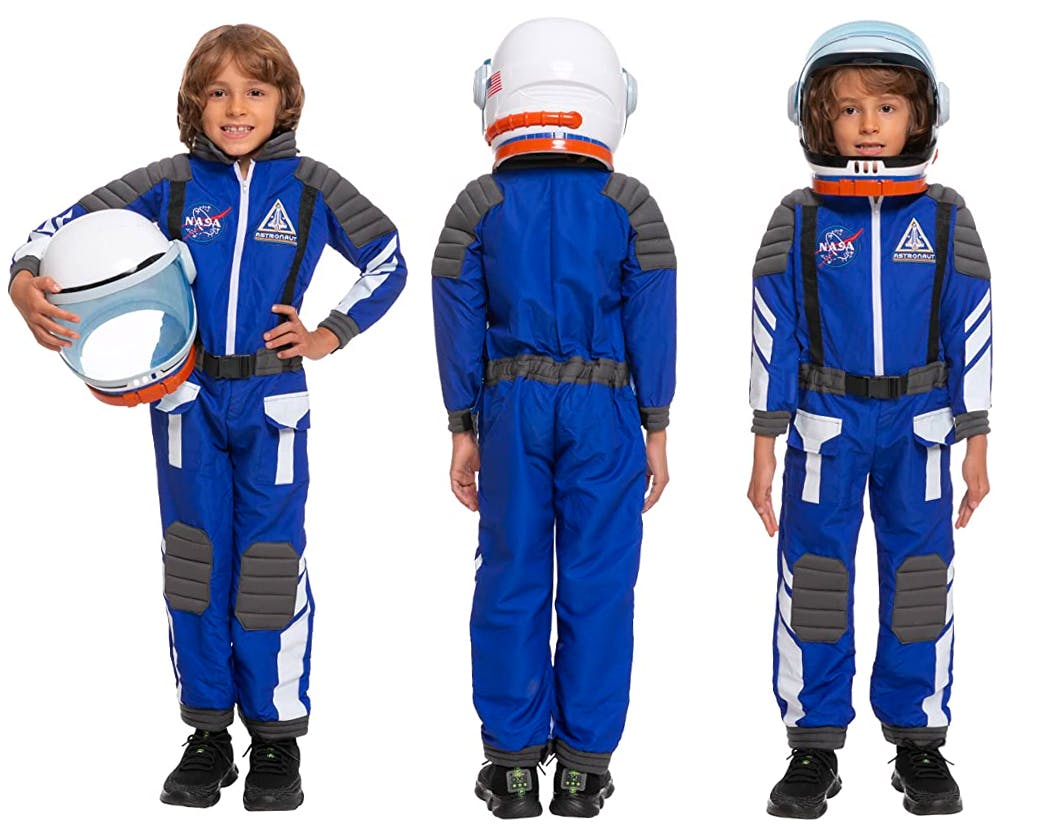 A child modeling an astronaut costume on a white background