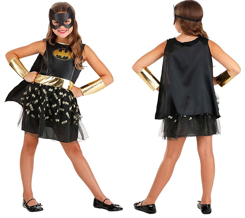 A girl wearing a Batgirl costume showing the front and back on a white background.