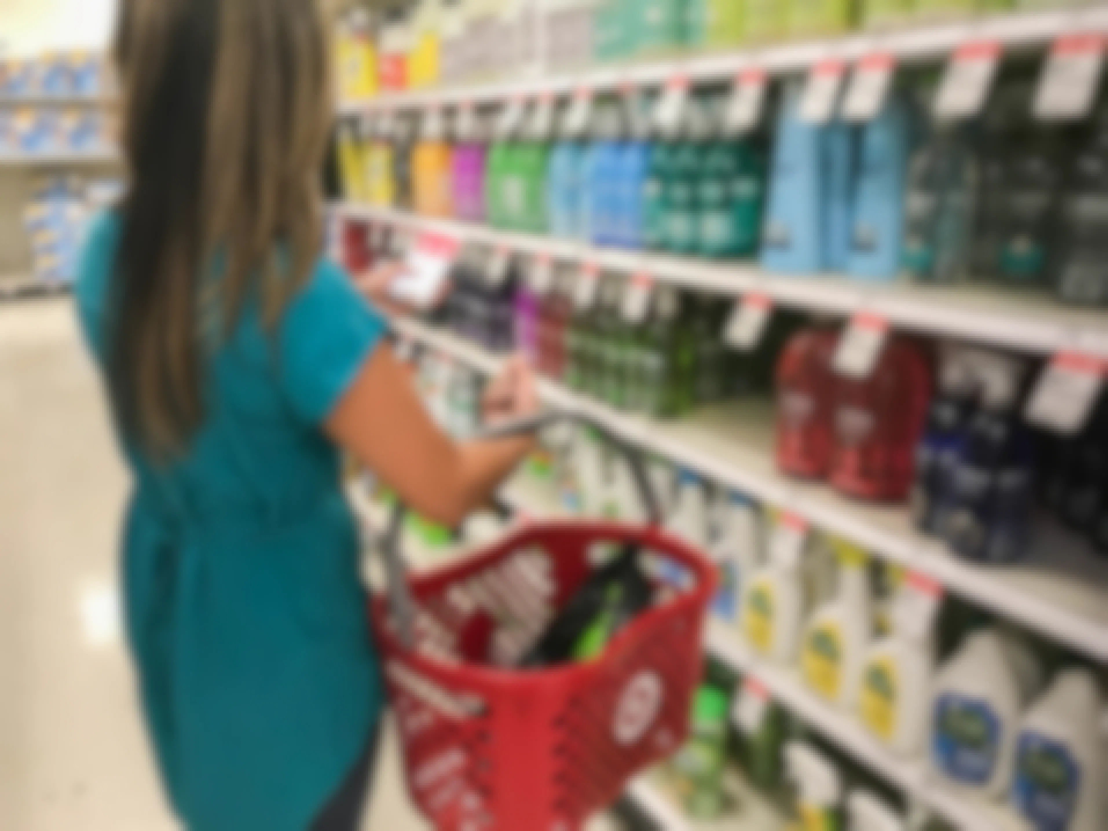 woman in Target shopping for hand soap with app and basket