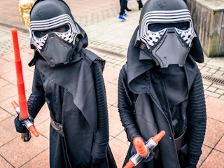 Two kids dressed up as Kylo Ren for Halloween