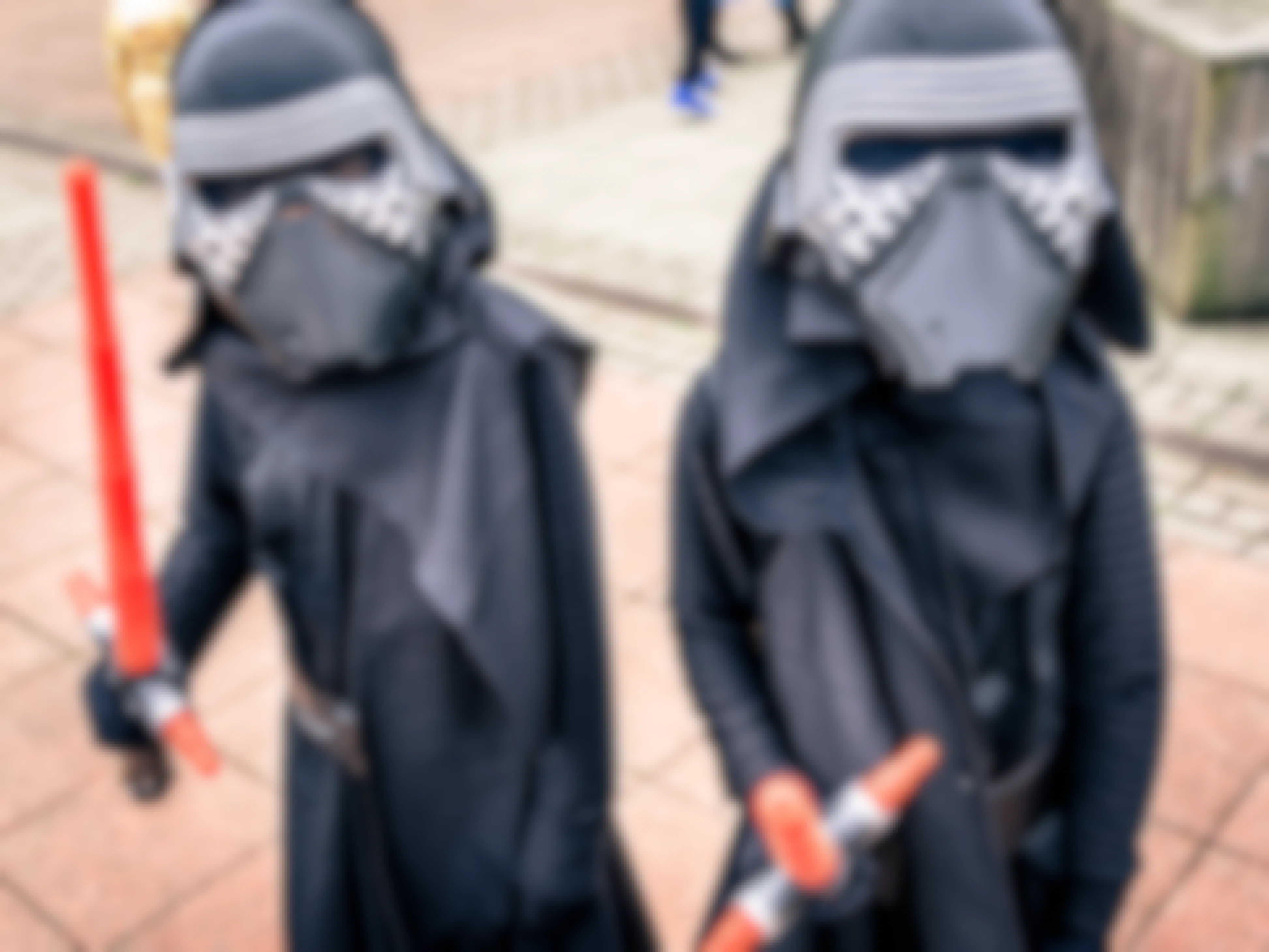 Two kids dressed up as Kylo Ren for Halloween