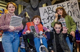 A group cosplaying as characters from Stranger Things at a convention.