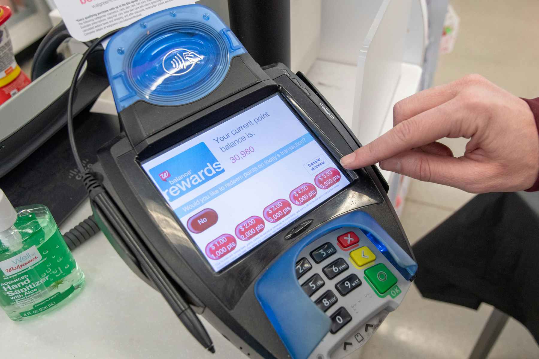 Walgreens rewards on credit card reader at checkout.
