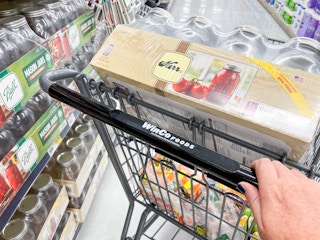 A case of Kerr canning jars in a WinCo shopping cart.