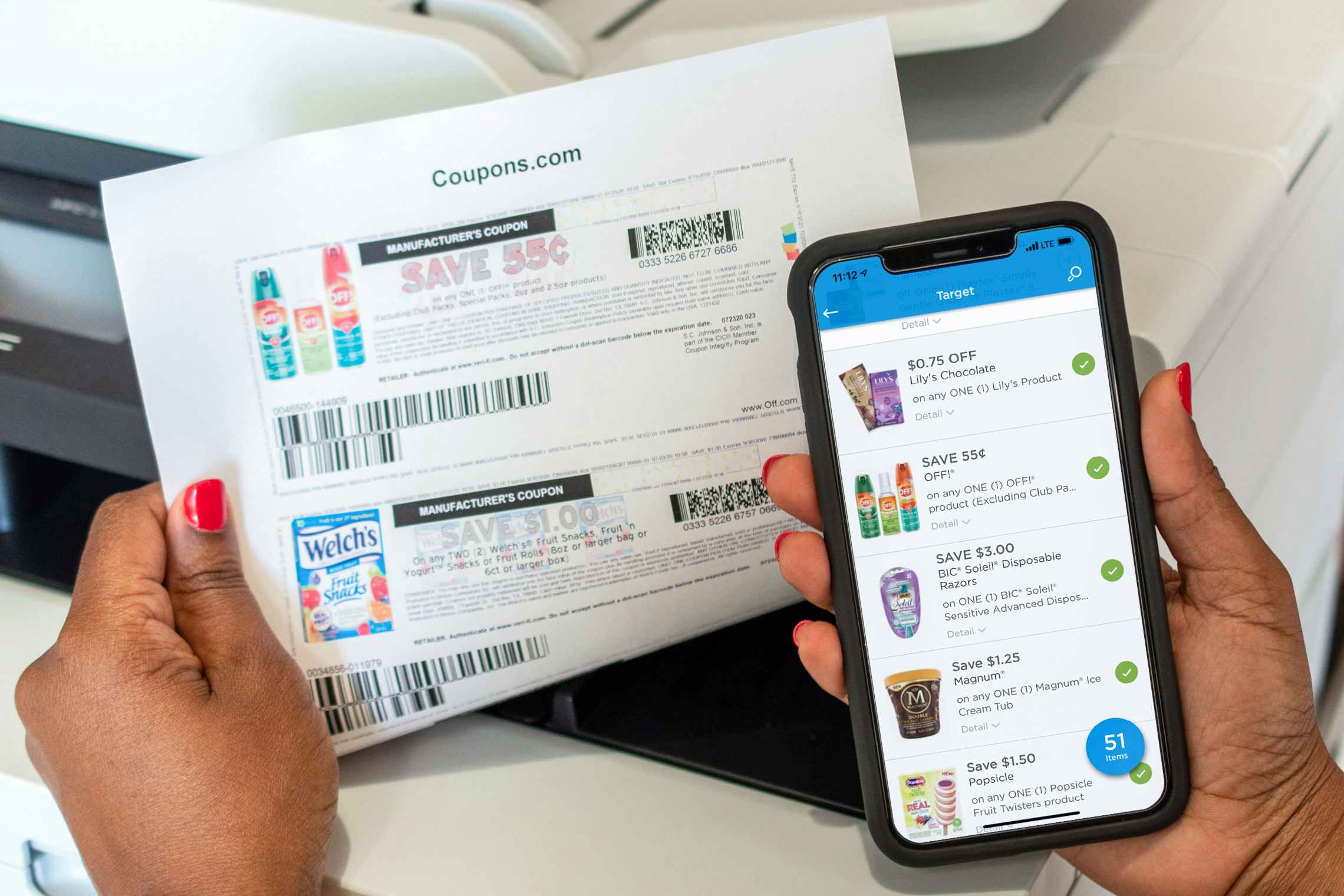 someone printing coupons from the coupons.com mobile app
