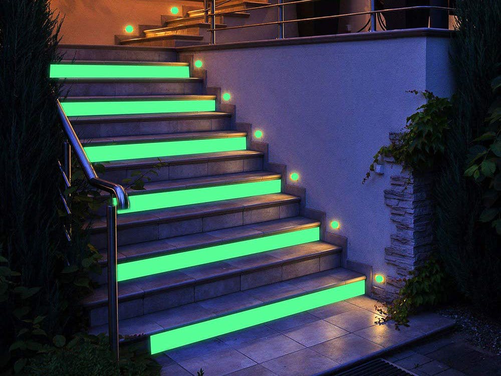 A staircase decorated with glow in the dark tape.