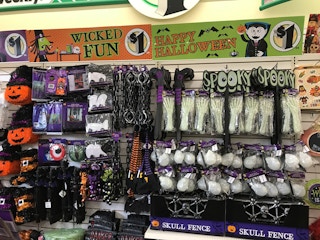 wall full of halloween decor at dollar tree