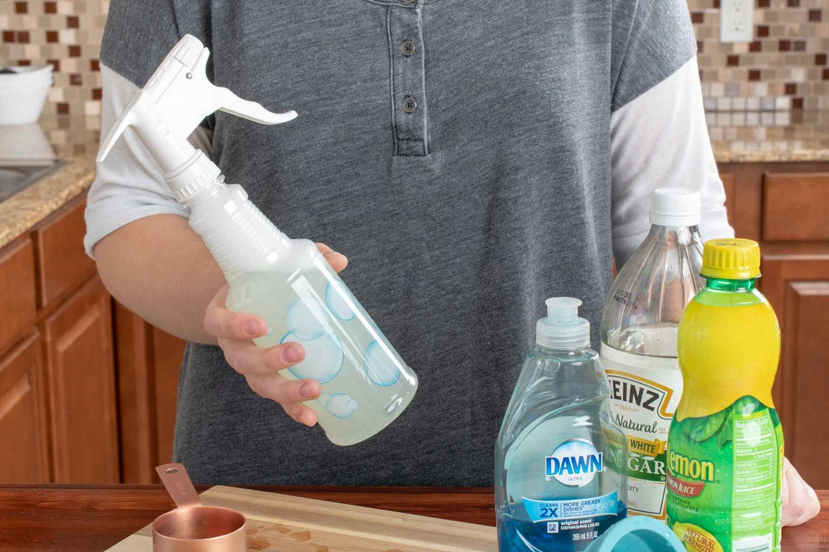 A hard water remover in a spray bottle