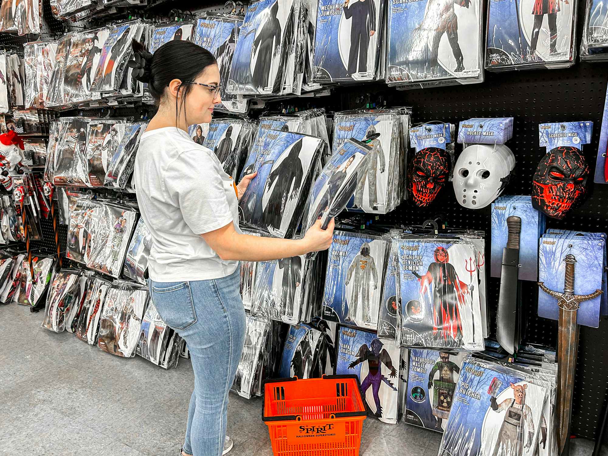 a person looking at costumes at spirit halloween