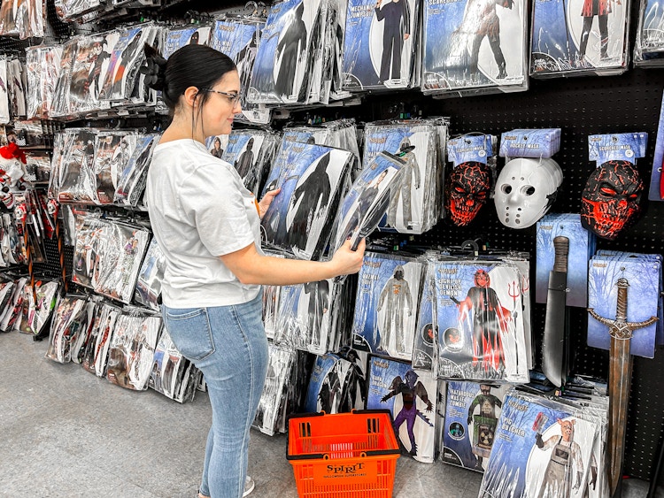 a person looking at costumes at spirit halloween