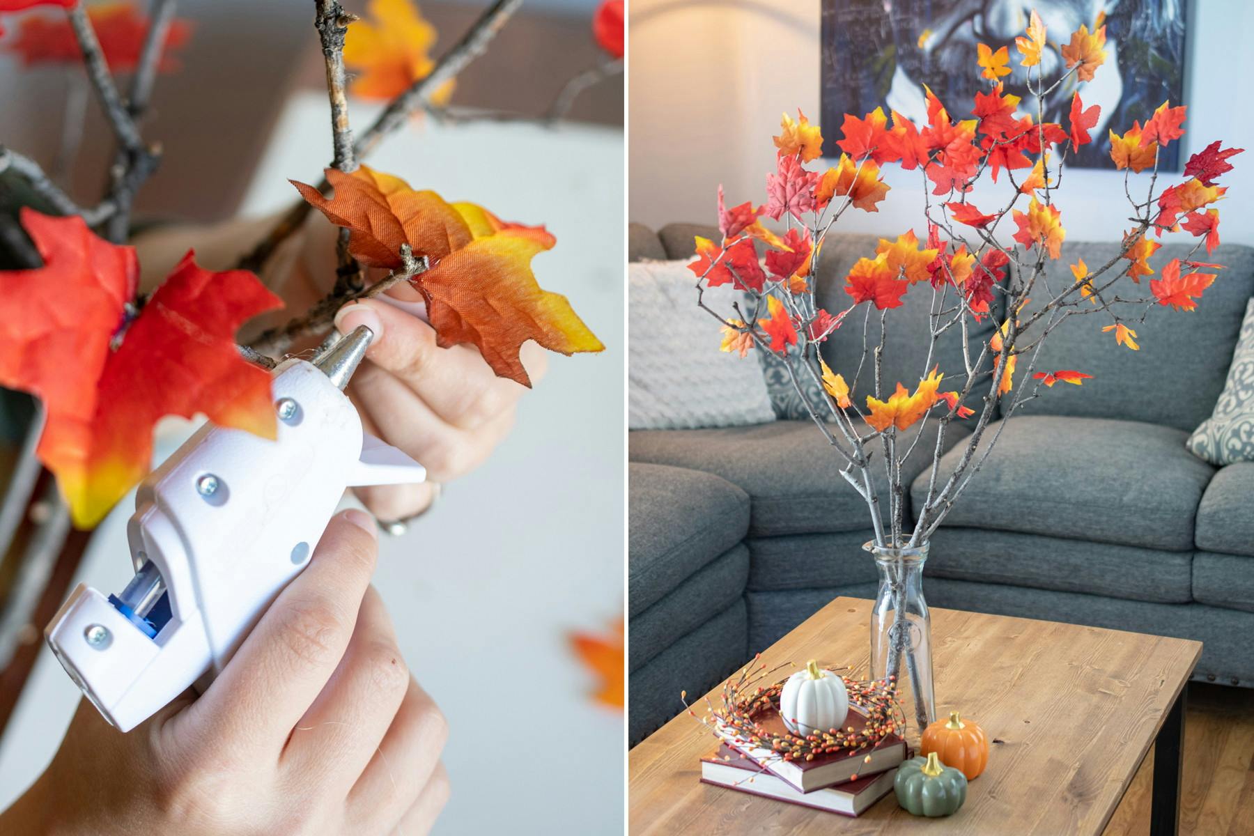 A person using a hot glue gun to glue fake fall leaves to a tree branch.