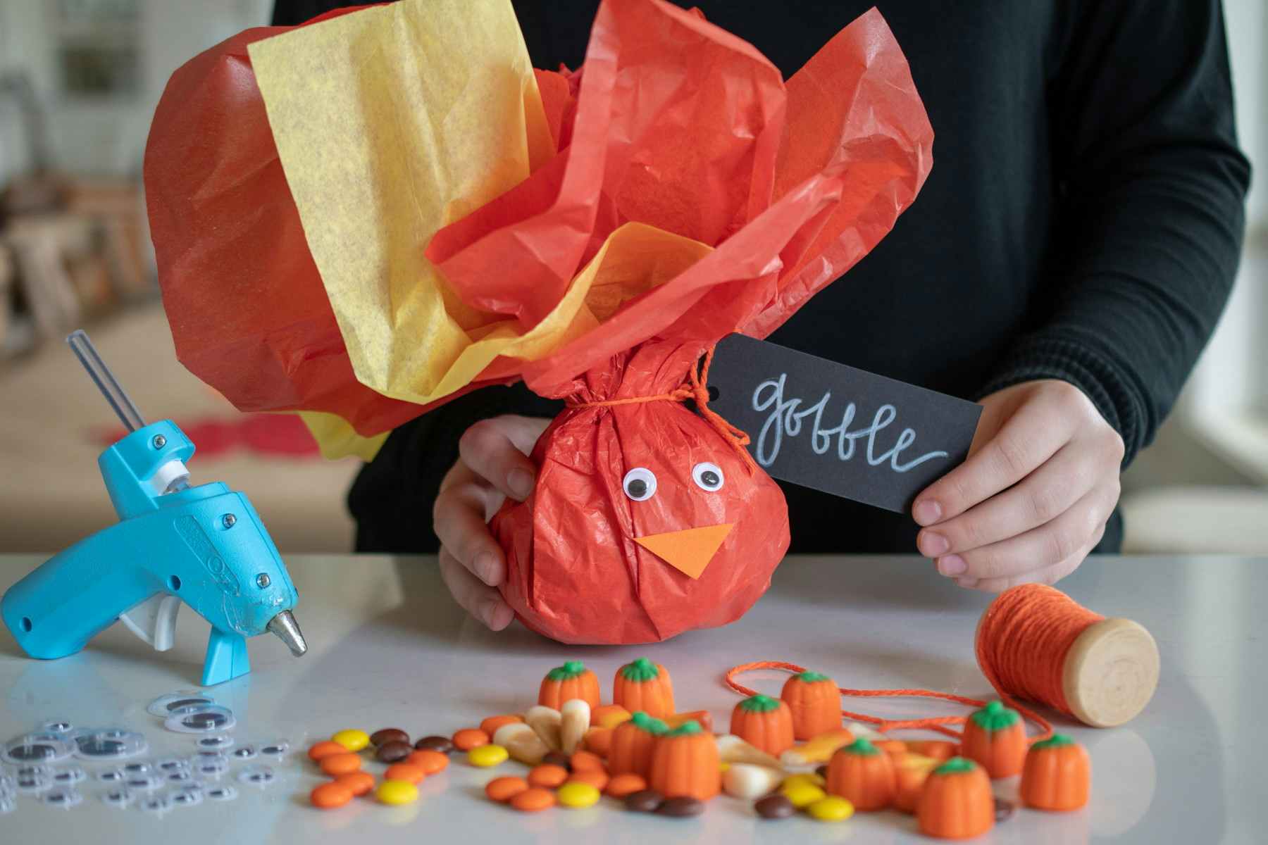 Tissue paper full of candy made to look like a colorful turkey. 