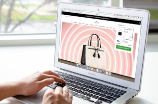 Someone looking at a bag on the Kate Spade website