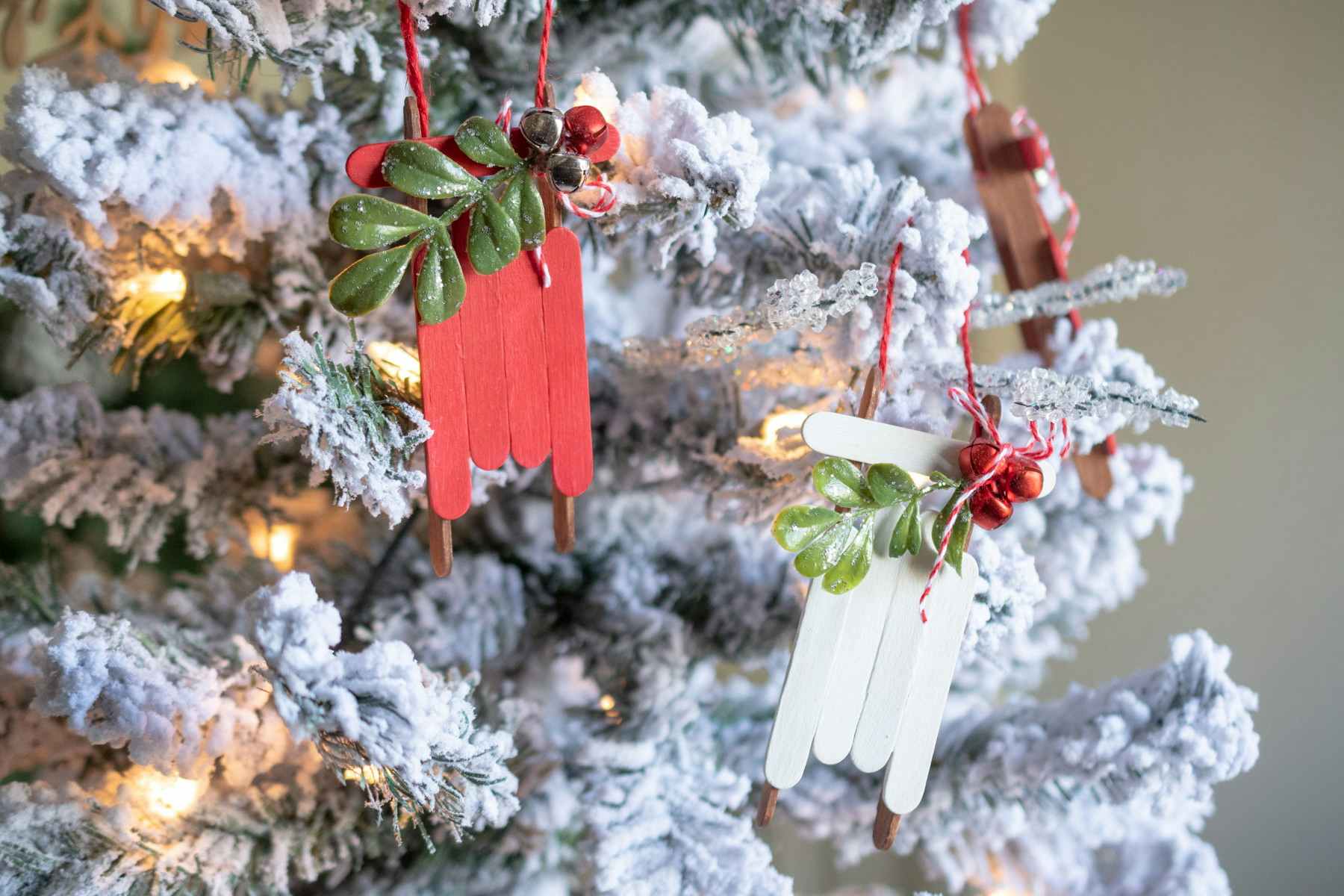sled ornaments hanging on a tree