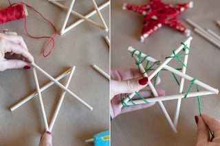 someone gluing wood together to make a star and putting string on it