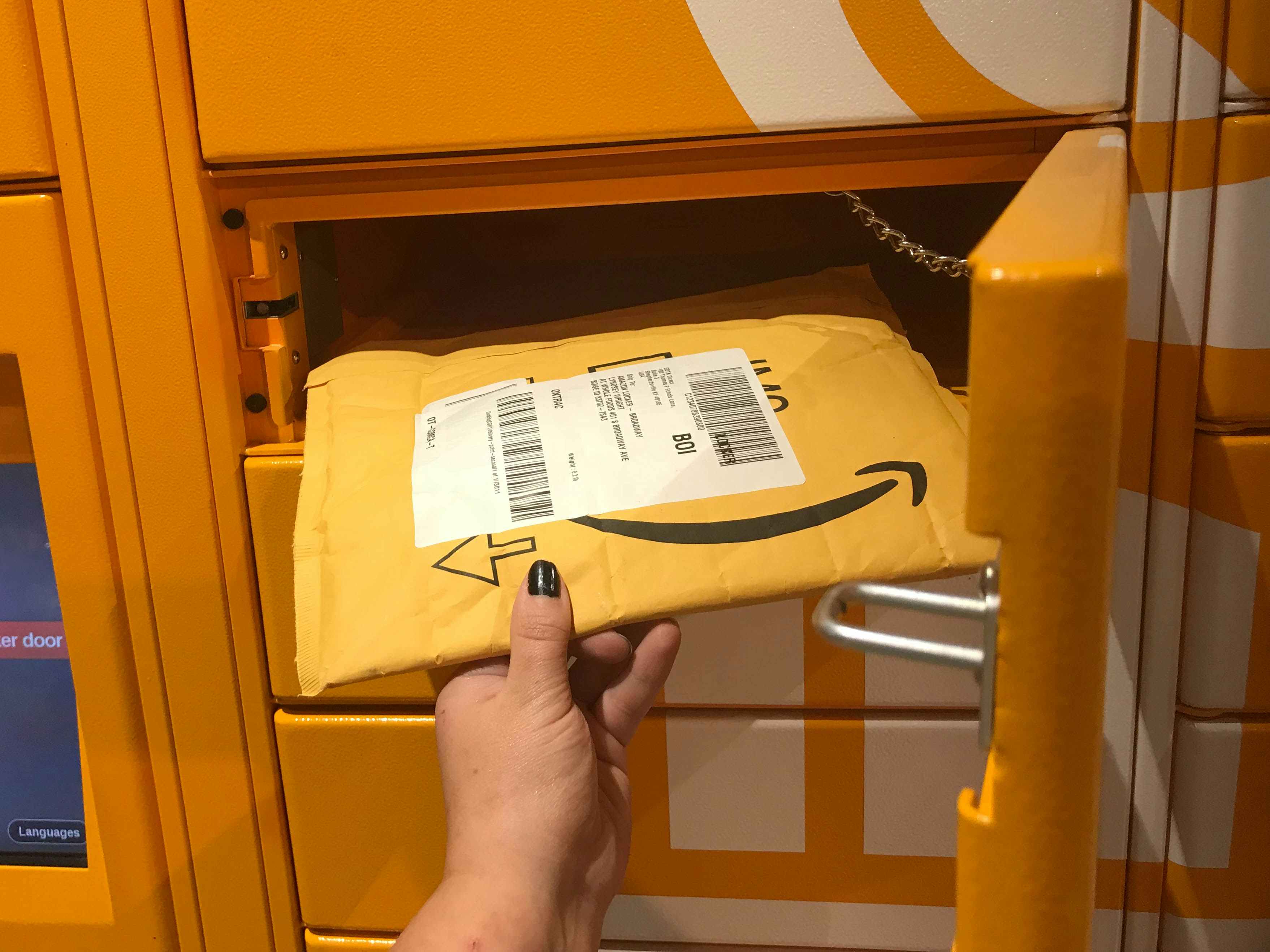an amazon package being put into an amazon locker 
