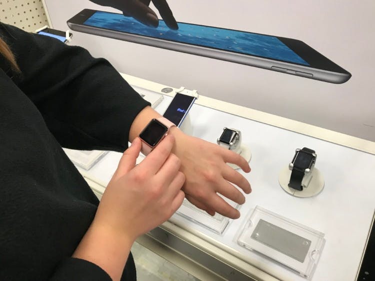 woman tries on an apple watch target in pink