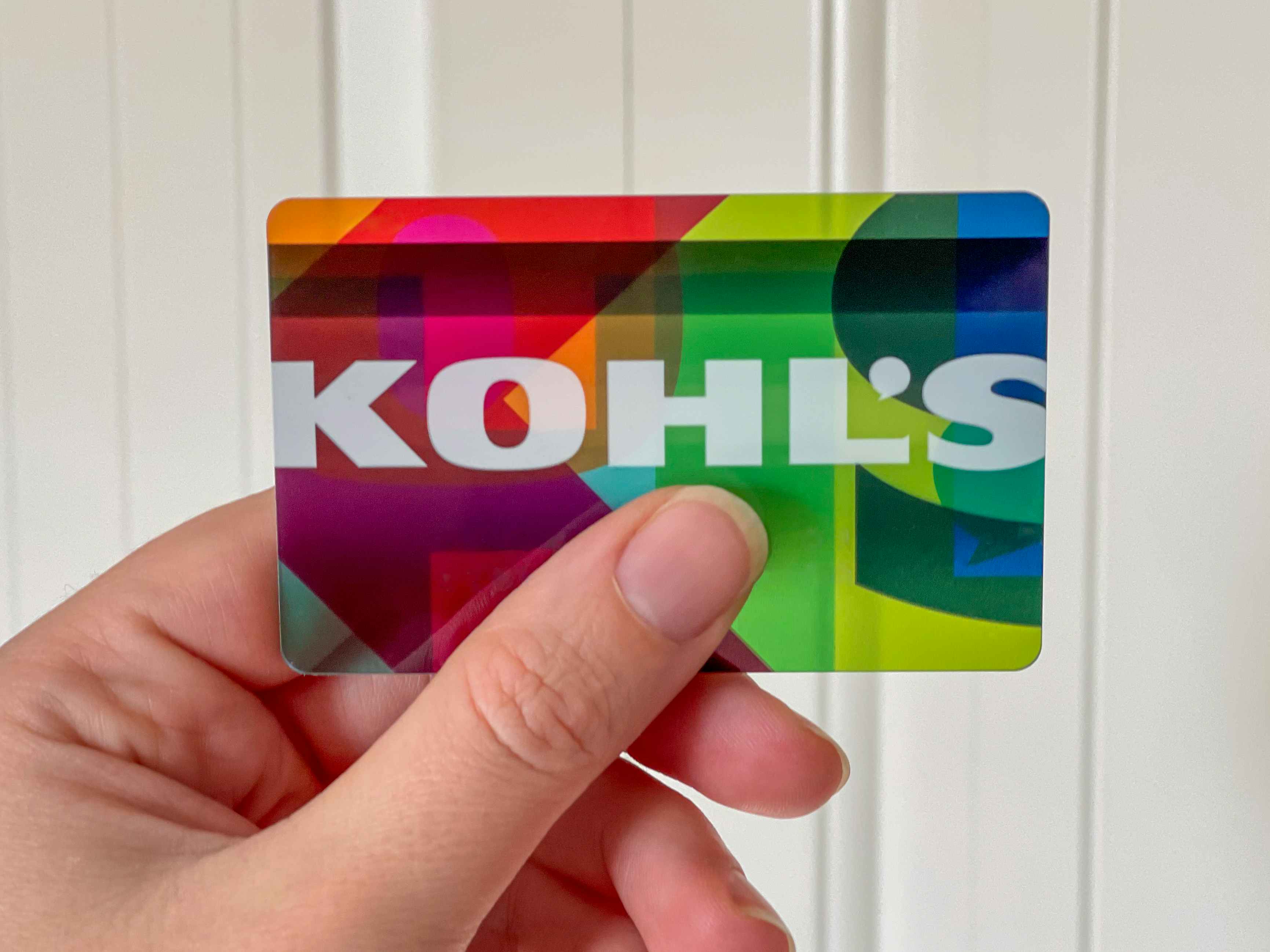someone holding their kohl's credit card