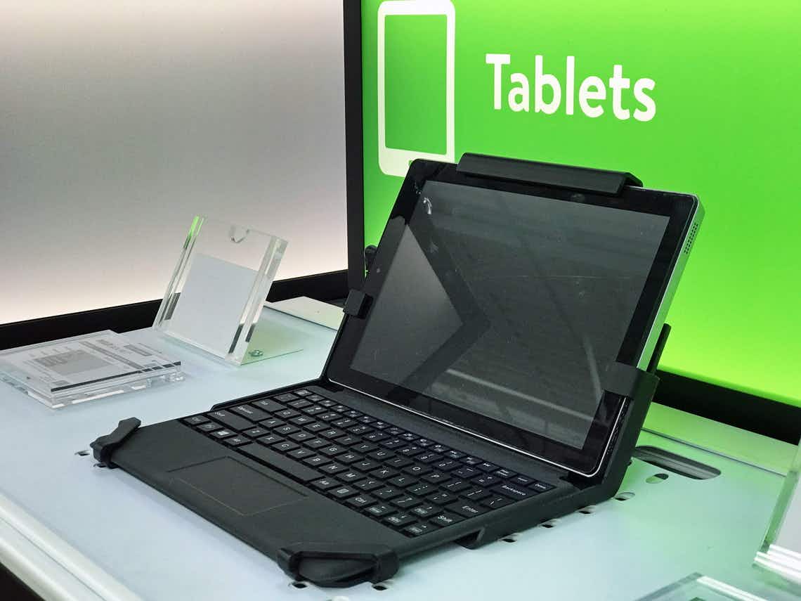 A tablet on a tablet in front of a sign that says Tablets at Walmart