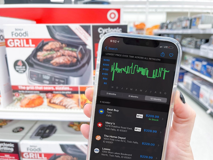 cell phone with shop savvy app in front of ninja foodi on shelf