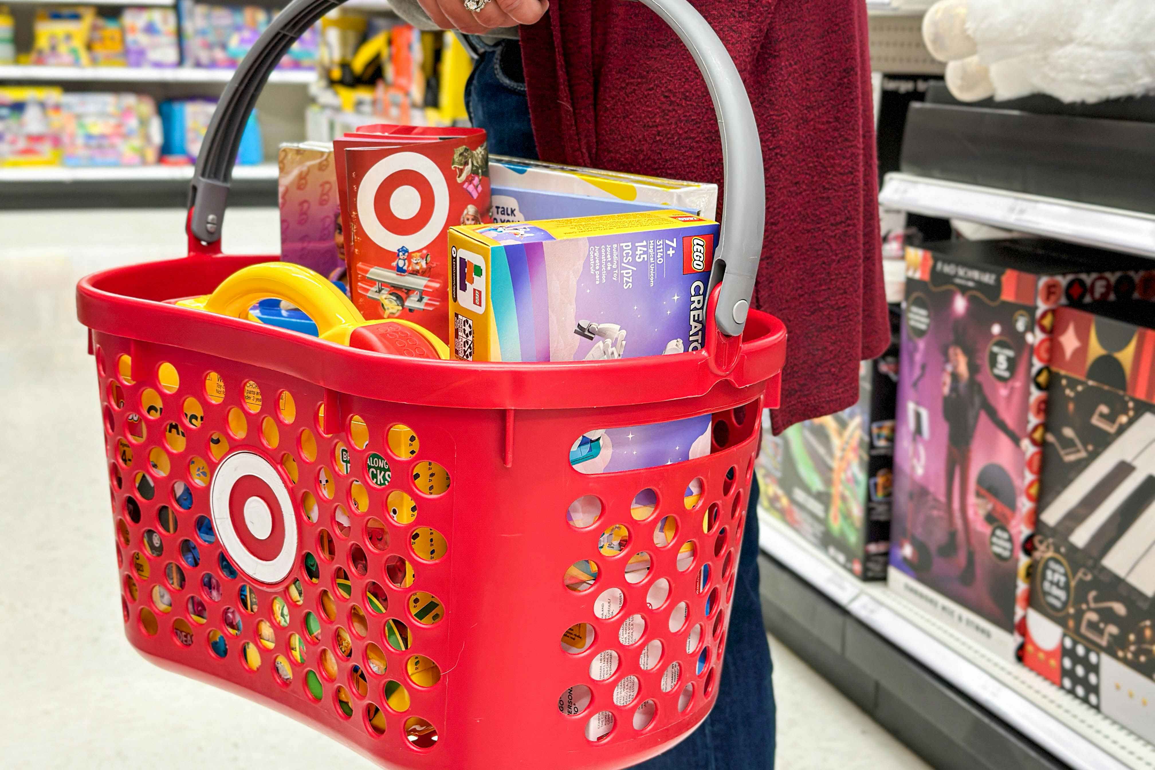 a person holding a basket full of target toys