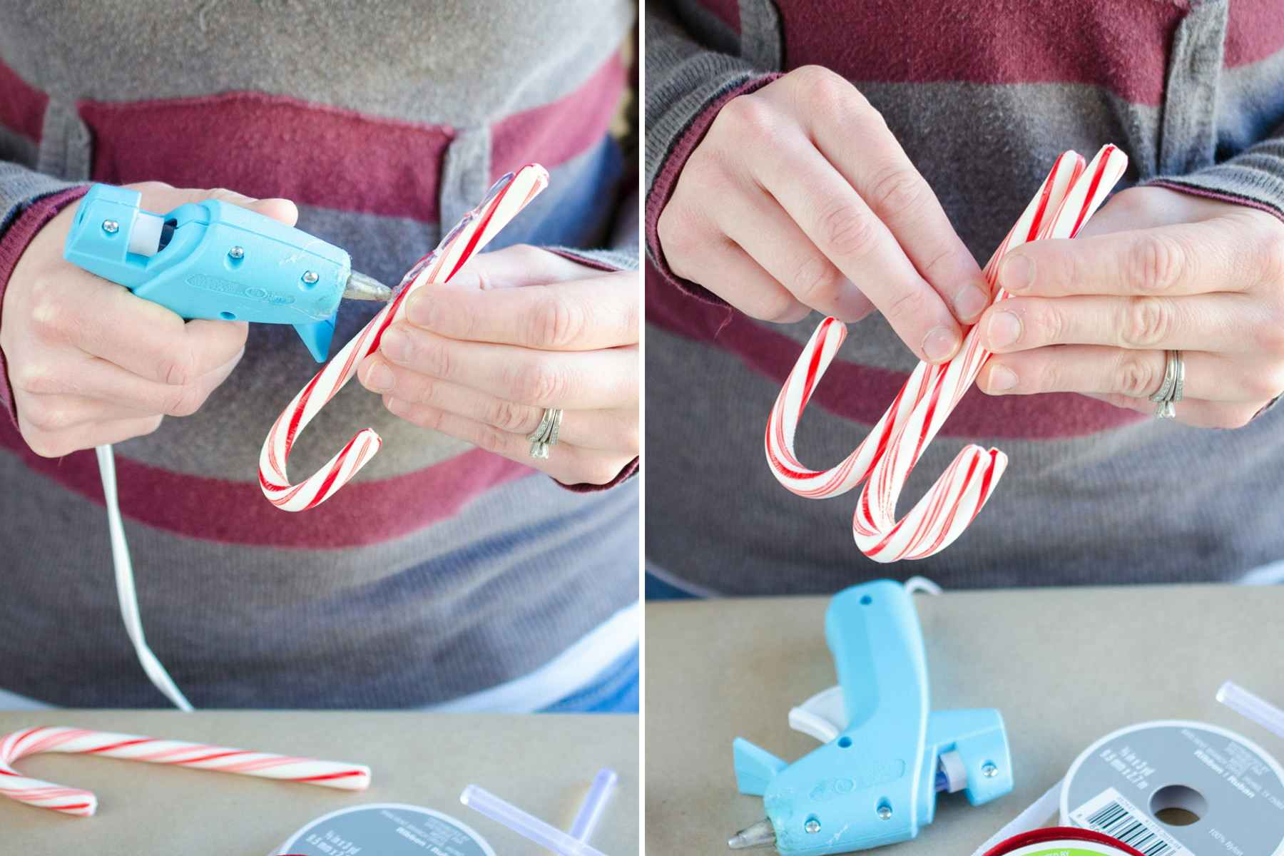 A person using a hot glue gun to attach 3 candy canes together