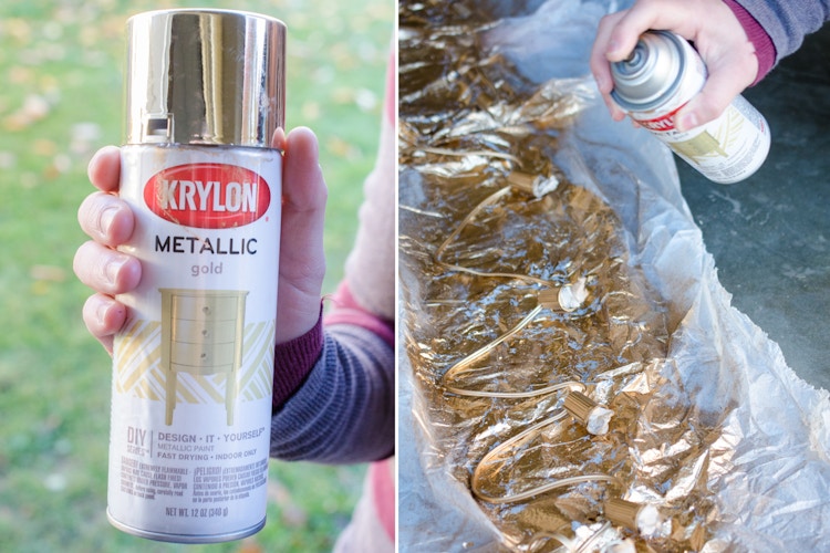 A person spray painting strand of c9 Christmas lights gold. The bulbs are missing from the strand.