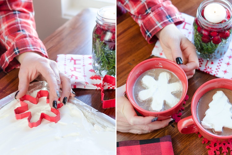 Frozen whipped cream being cut with a cookie cutter and placed in a cup of hot chocolate.