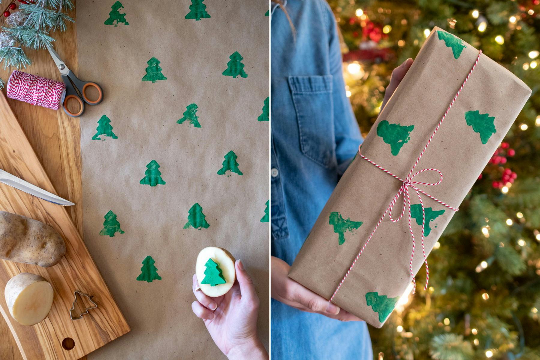 A person using a potato with a Christmas tree shape cut out of it to stamp green Christmas trees onto brown paper, making their own wrapping paper.