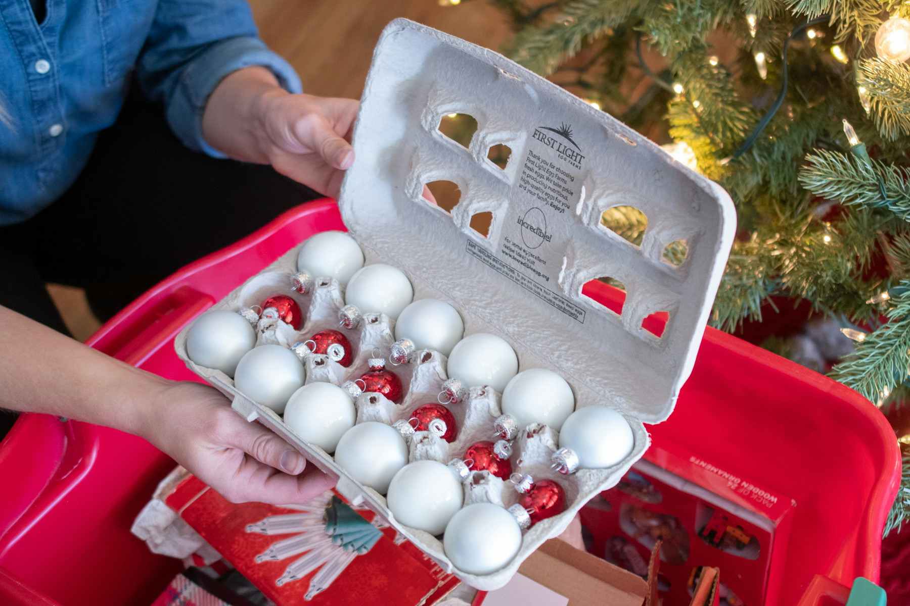 Small glass ornaments stored in an egg carton. 