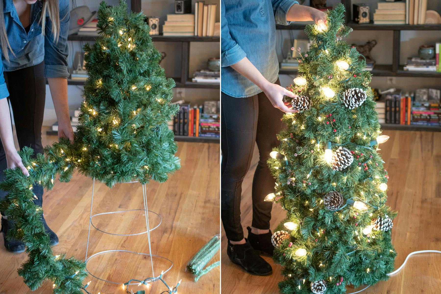 A small lit Christmas tree made from garland, lights, and a tomato cage.