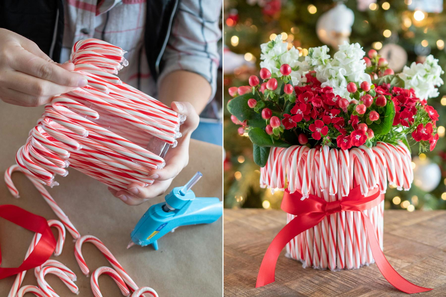 Candy Canes hot glued around a round vase filled with flowers and tied with a red ribbon.