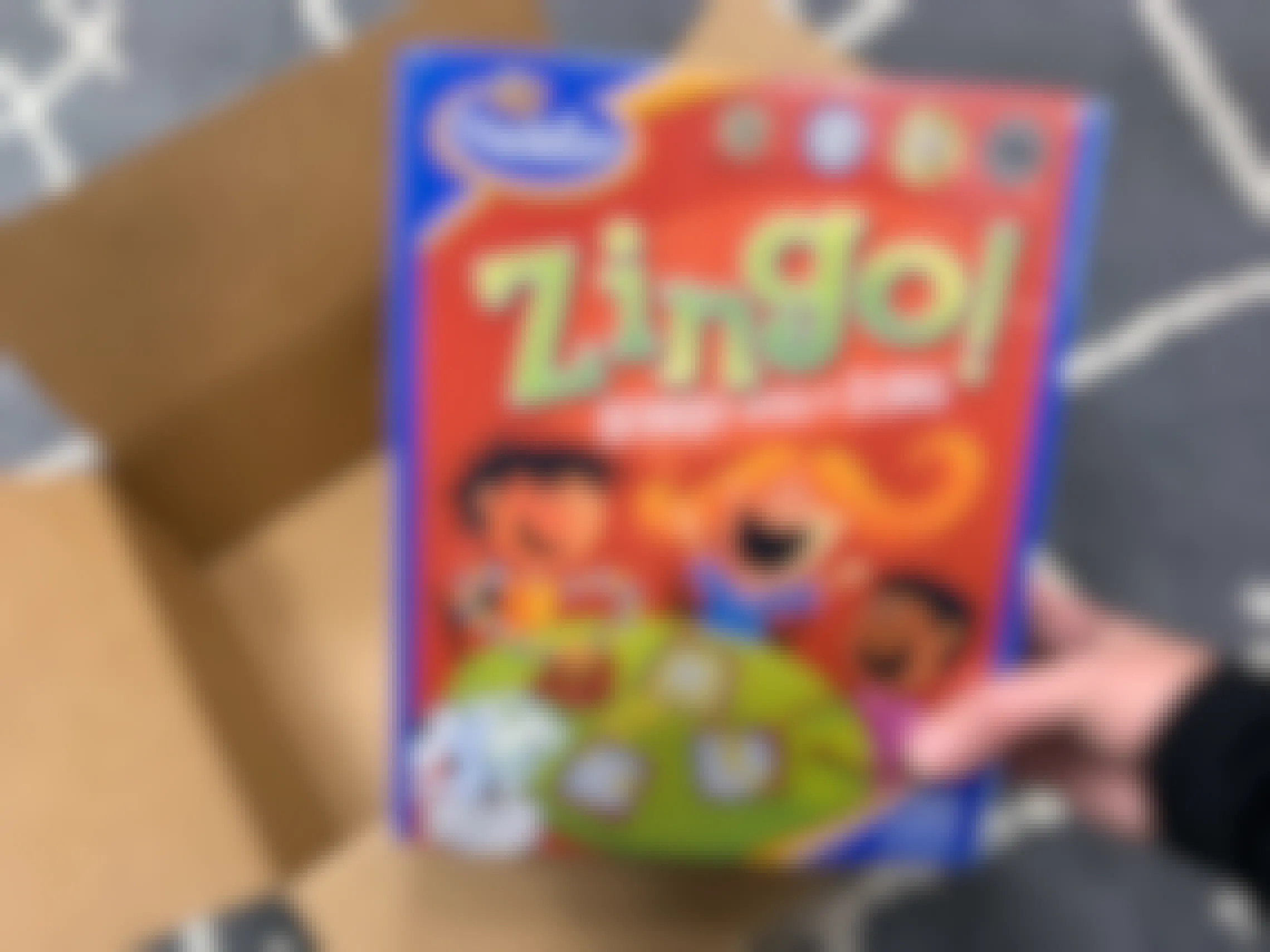 Zingo Board game next to an amazon box