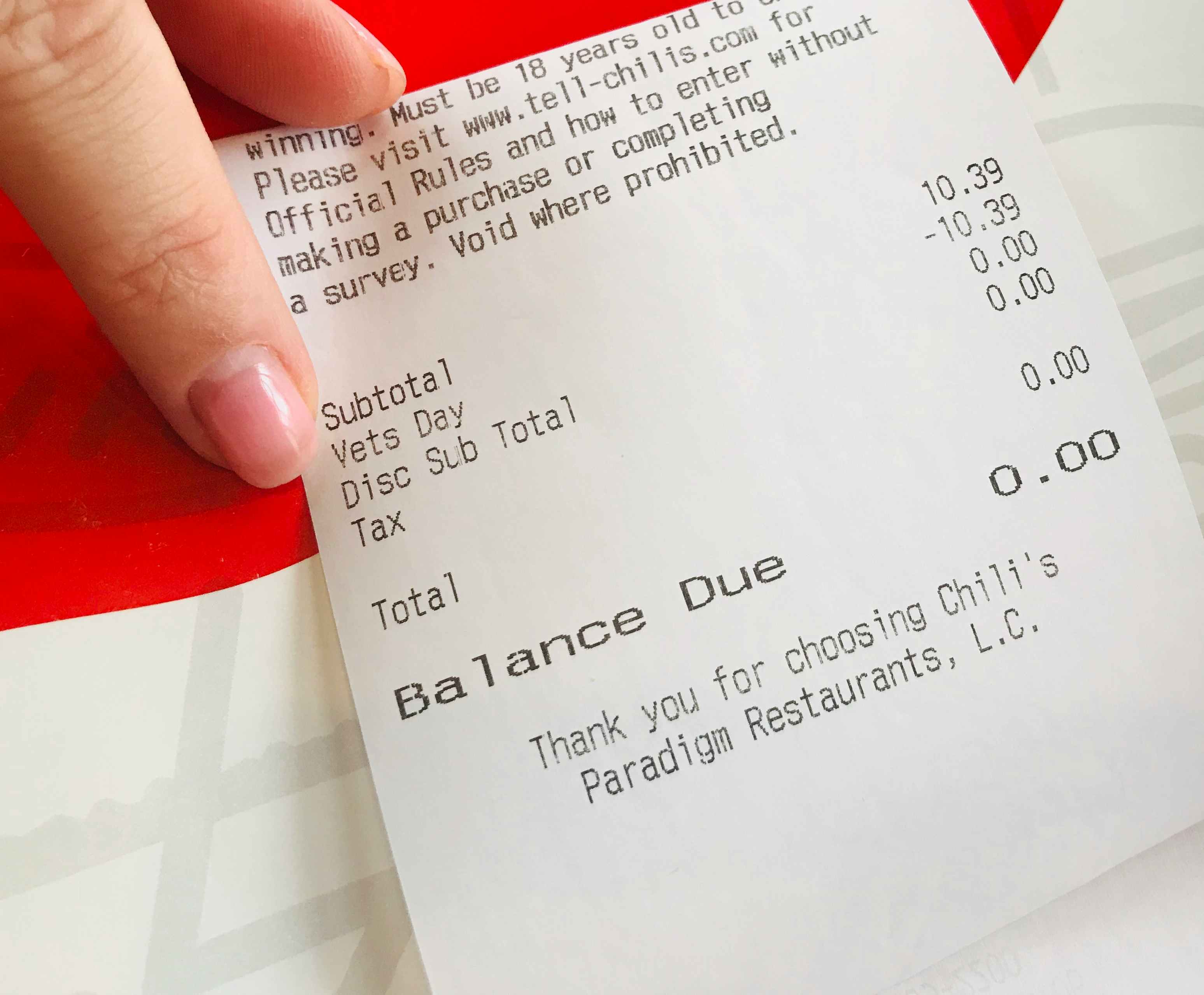 A receipt with $0.00 due because of a Veteran's Day discount applied to the total.